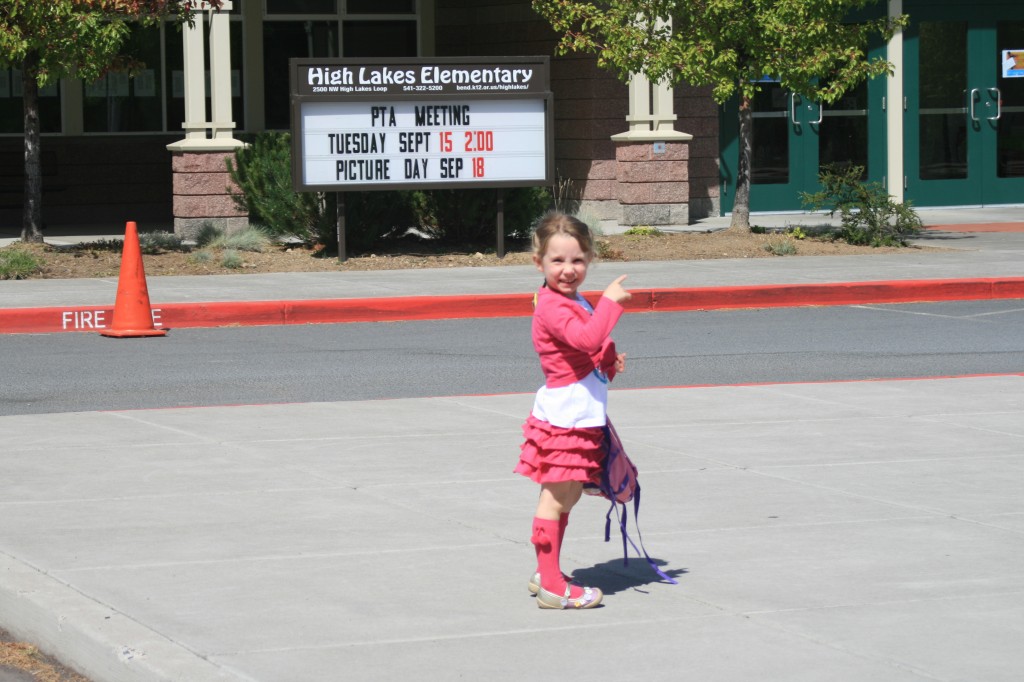 In front of High Lakes Elementary. "Here's my new school!"